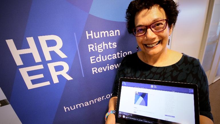 Audrey Osler at USN showing the Human Rights Education Review journal. photo.